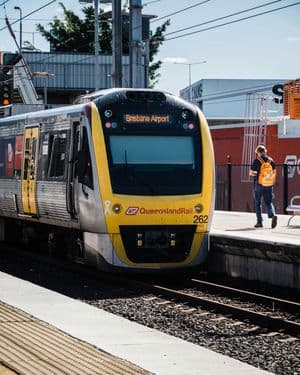 A commuter train at a suburban railway station platform