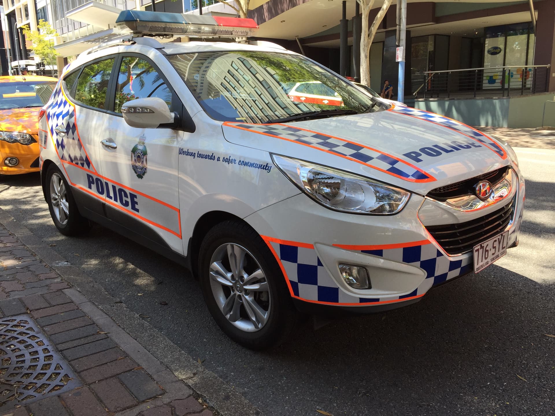 A Queensland Police Service Hyundai ix35 patrol car parked in central Brisbane, illustrative of a QPS response in the Logan region.