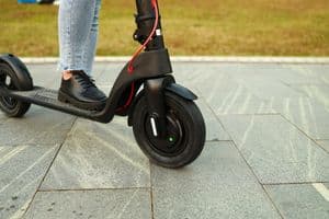 Person riding an electric scooter on a path