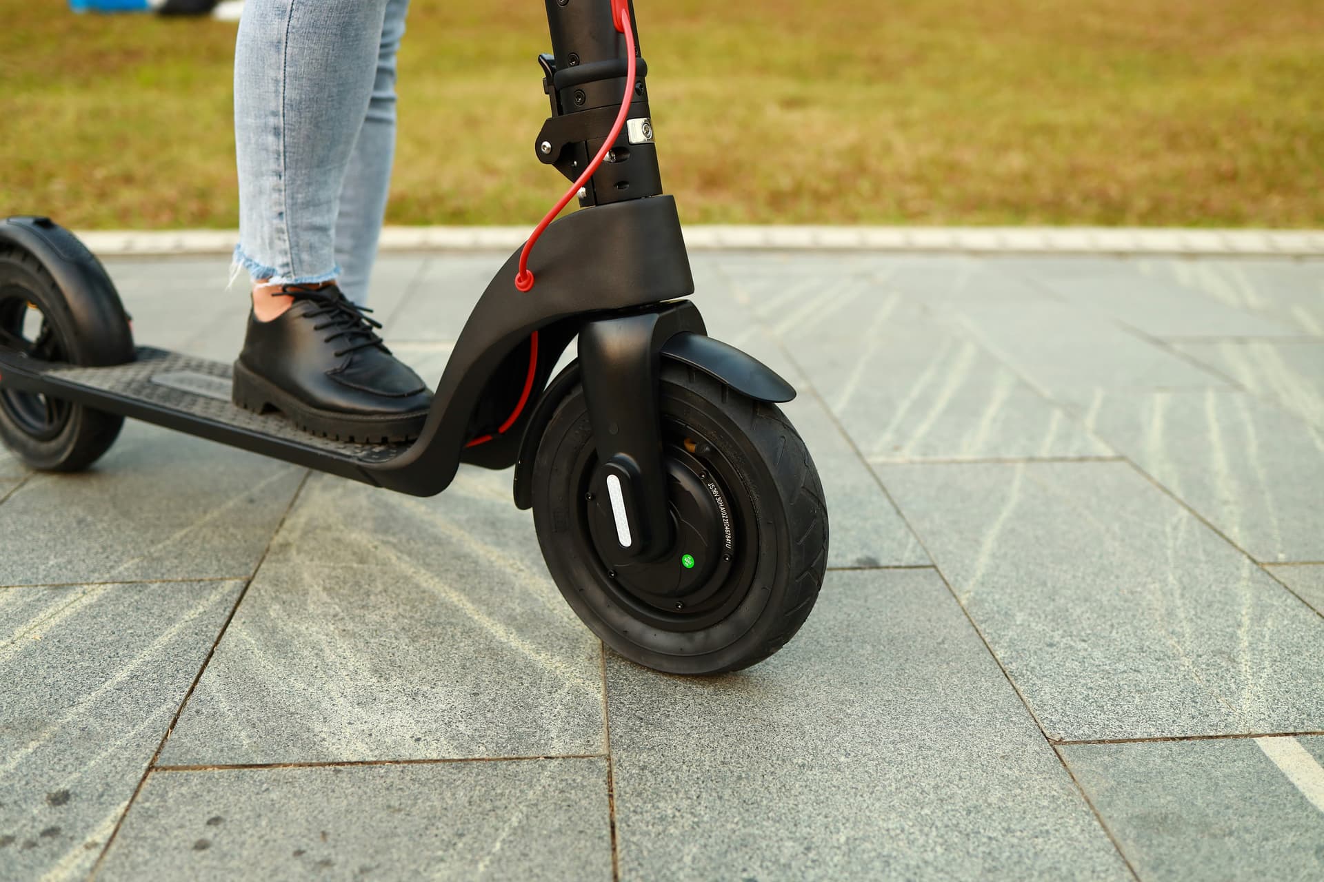 Person riding an electric scooter on a path